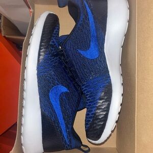 Blue and black Nike sneakers